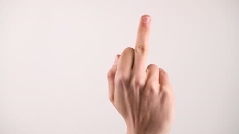 Taunting-middle-finger-coming-into-frame-on-a-white-background