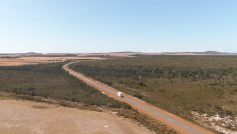Campervan-driving-over-an-empty-road-in-Margaret-River-in-West-Australia