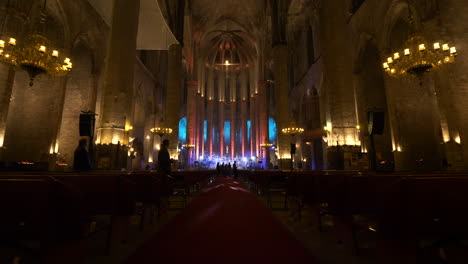 Decorated-stage-with-glowing-lights-in-Barcelona-Cathedral,-dolly-forward-view