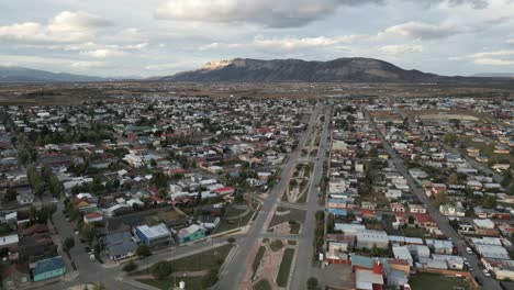 Scenic-Cityscape-of-Puerto-Natales-City,-Chile,-Torres-del-Paine-Mountain-Landscape,-Aerial-Drone-View