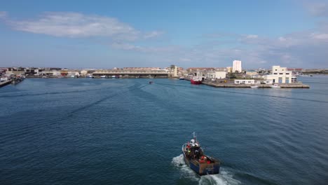 Fishing-Boat-Arriving-in-Peniche,-Portugal-Marina-Harbour---Aerial-Drone-View
