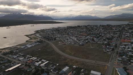 Aerial-View-Of-Houses-Landscape,-Sea-During-Sunny-Day-in-Puerto-Natales,-Chile,-Scenic-Antarctic-Patagonia,-Gulf-Montt