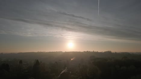 Sun-Over-Misty-Winter-Landscape-Aerial-Slow-Motion-Warwickshire-UK