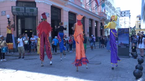 Colourful-dancers-on-stilts-dancing-to-the-conga-drums