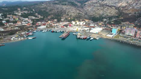 Fishing-and-commercial-ships-are-anchored-in-the-small-port-of-Shengjin-in-Albania,-aerial-view