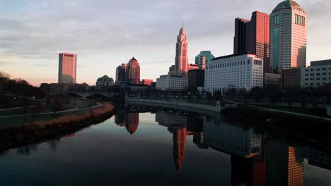 Drone-at-sunrise-downtown-Columbus-reflected-on-river