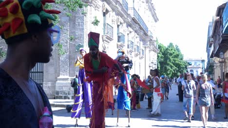 Dancers-on-stilts-showing-off-their-balance-in-Obispo-street