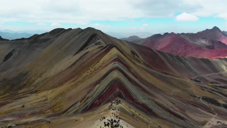 Rainbow-Mountain,-Peru,-aerial,-symmetric-tilt-up