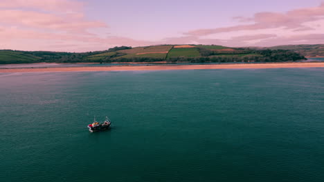 A-Drone-shot-circling-a-fishing-boat-on-the-18