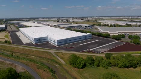 Aerial-approach-shot-of-new-industrial-building-in-an-industrial-area