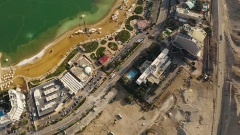 4K-Aerial-drone-top-down-shot-rocky-mountains-near-the-dead-sea-hotel-zone