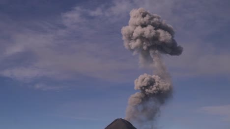 Zoomed-in-shot-of-a-volcano-that-spits-out-smoke-in-slow-motion