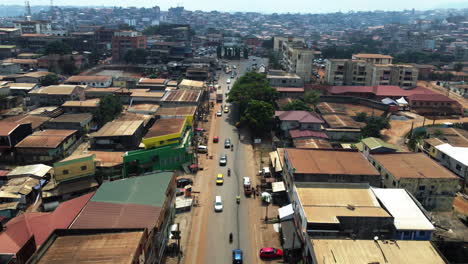 Aerial-view-over-traffic-on-a-street-in-the-city-of-Yaounde,-in-sunny-Cameroon