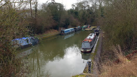 Canal-house-narrow-boats-on-a-river-in-the-british-countryside