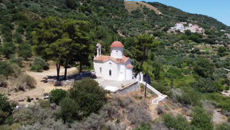 Church-of-Agios-Panton-in-Topolia,-Crete,-Greece---aerial-view-in-mountains