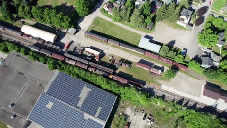Flying-Over-Abandoned-Trainyard-Rural-Canada-in-a-Small-Town