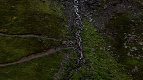 4k-aerial-drone-footage-in-alaska-of-a-waterfall-stream-down-a-mountain-near-palmer
