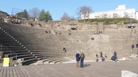 Tourists-sightseeing-around-ancient-roman-theatre-of-Fourvière-in-Lyon,-France