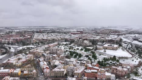 Aerial-snowscape-of-the-city-of-Salamanca,-Spain
