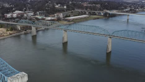 Drone-fly-toward-Chattanooga-Tennessee-walking-bridge-over-the-river-downtown