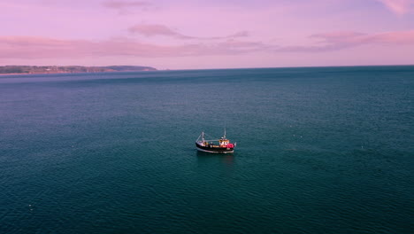A-Drone-shot-circling-a-fishing-boat-on-the-18
