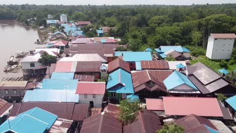 Aerial-view-of-a-small-tropical-village-near-the-river