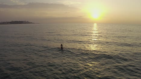 4k-Aerial---Man-paddle-boarding-stand-up