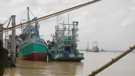 Fishing-boats-docked-in-the-harbor-in-Songkhla,-Thailand