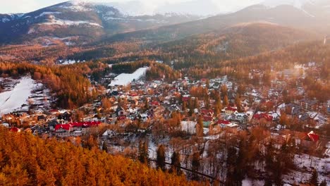 Drone-shot-of-a-Karpacz,-polish-mountains-forest-during-autumn-during-sunset