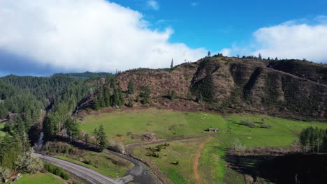 Beautiful-4K-aerial-drone-shot-overlooking-tree-landscape-and-little-farm-in-Southern-Oregon