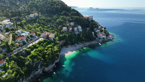Drone-views-over-the-resorts,-houses-and-coastline-in-Durbovnik