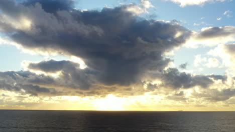 Sunrise-over-the-pacific-ocean-with-large-clouds-in-the-sky,-near-Bondi-Australia
