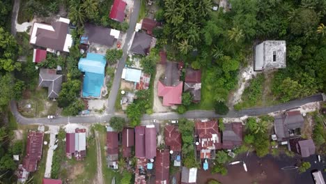 Aerial-view-of-a-small-tropical-village-near-the-river