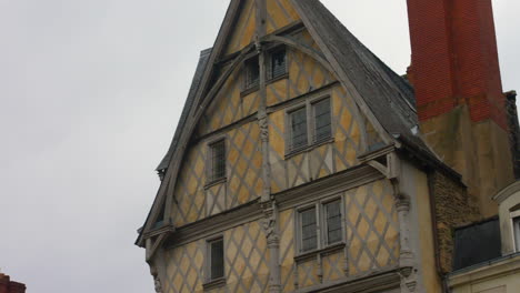 House-Of-Adam,-Old-Half-timbered-House-In-The-City-Of-Angers,-France---low-angle