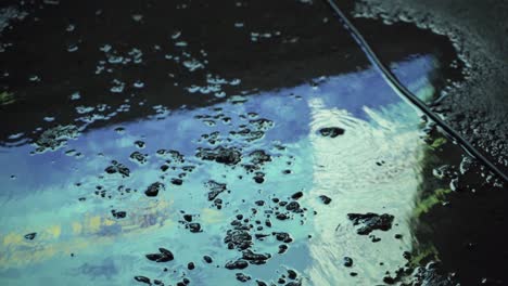 Water-reflection-on-asphalt-concrete-road-during-the-night