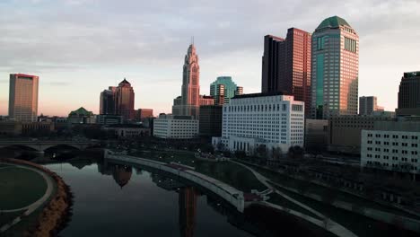 Drone-over-downtown-Columbus,-OH-at-sunrise