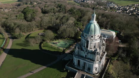 Ashton-Memorial-monument-in-Williamson-Park-Lancaster-UK-slow-high-orbit-clockwise-from-the-south-showing-parkland-and-monument-shadow