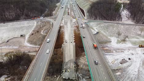 Demolished-middle-bridge-of-A1-highway-in-Kaunas,-aerial-fly-backward-view