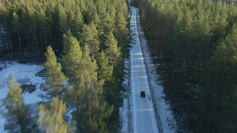 ATV-driving-down-a-icy-road-in-winter
