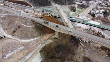 Heavy-machines-working-on-collapsed-Kleboniskis-bridge-in-Kaunas,-aerial-drone-view