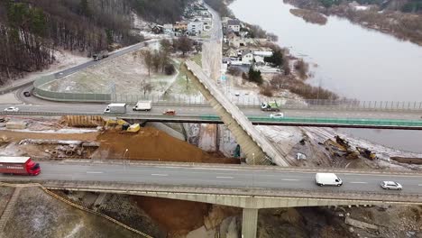 Danger-of-collapsed-bridge-in-Kaunas-city,-aerial-drone-fly-away-view