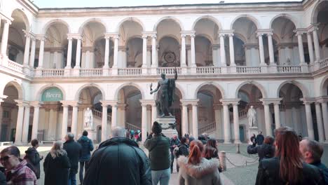 People-Tourists-Visit-the-Pinacoteca-in-Milan,-historic-theater-complex-cultural-meeting-place-in-the-Brera-neighborhood