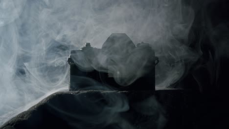 White-smoke-on-a-vintage-reflex-camera-with-no-lens---01