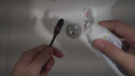 Point-of-view-of-a-person-using-toothbrush-and-toothpaste