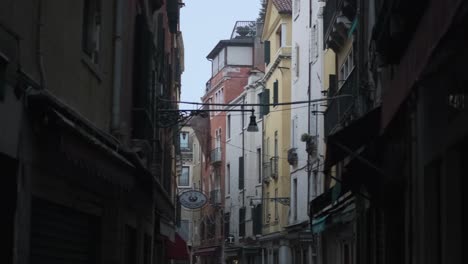 Smooth-gimbal-shot-through-the-quiet-colourful-streets-of-Venice-in-the-early-morning