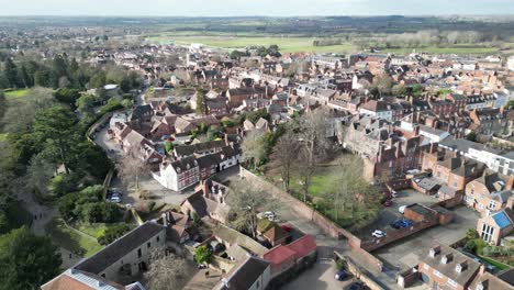 Low-panning-shot-Warwick-market-town,-Warwickshire-UK-Drone,-Aerial