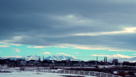 Suburban-neighborhood-on-a-blustery,-winter-day---time-lapse