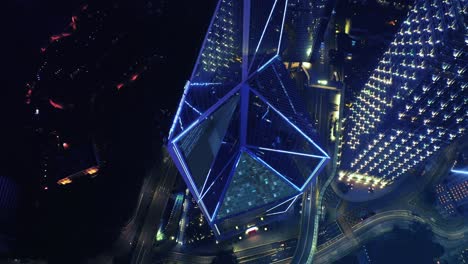 Aerial-overhead:-Digital-lines-connecting-Bank-of-China-Skyscraper-with-City-of-Hong-Kong-at-night---Futuristic-concept-design-with-motion-graphic