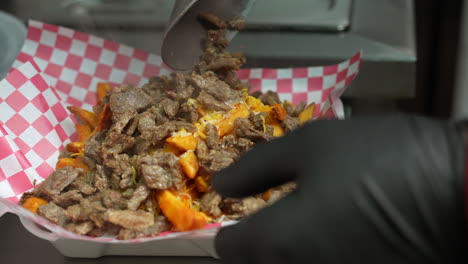 Steaming-hot-cheese-fries-with-grilled-steak---food-truck-series