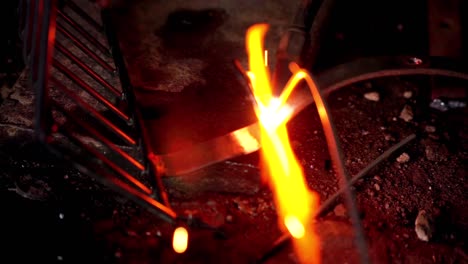 Close-up-shot-of-Iron-welding-process,-Worker-welds-metal